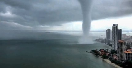 Mega water spout larger than skyscraper caught on camera in Malaysia